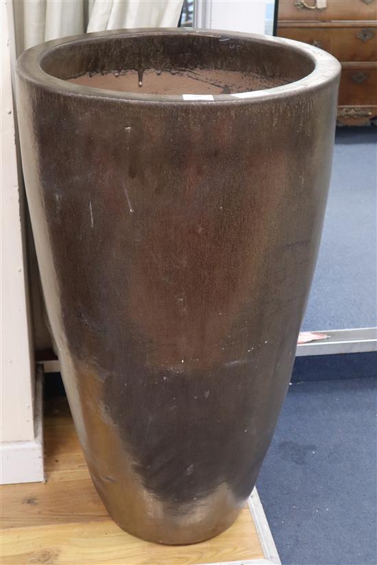 A tall gold glazed garden planter H.90cm